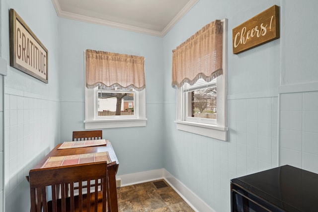 miscellaneous room with tile walls and crown molding