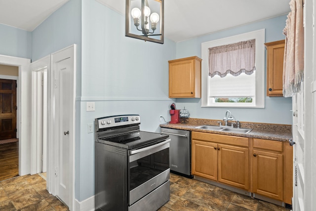 kitchen featuring a chandelier, sink, and stainless steel appliances