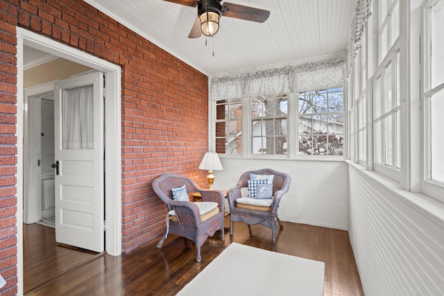 sunroom with ceiling fan and a wealth of natural light