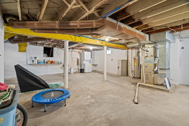 basement featuring gas water heater and heating unit