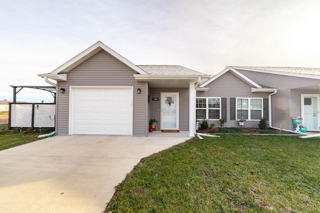 ranch-style home featuring a garage and a front yard