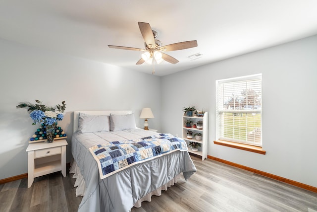 bedroom featuring ceiling fan and light wood-type flooring