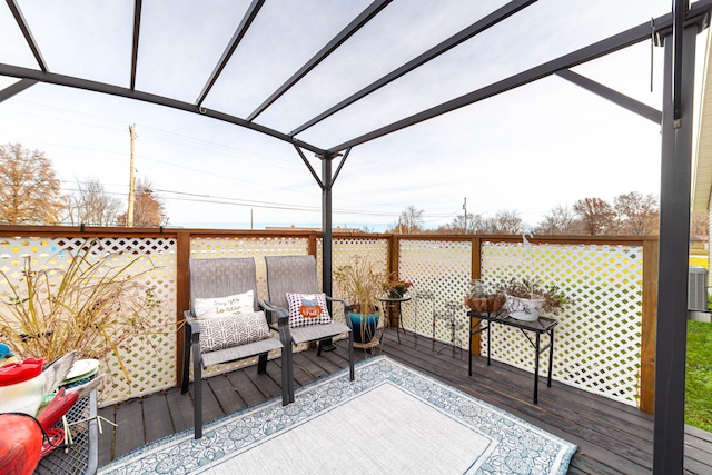 wooden deck featuring a pergola