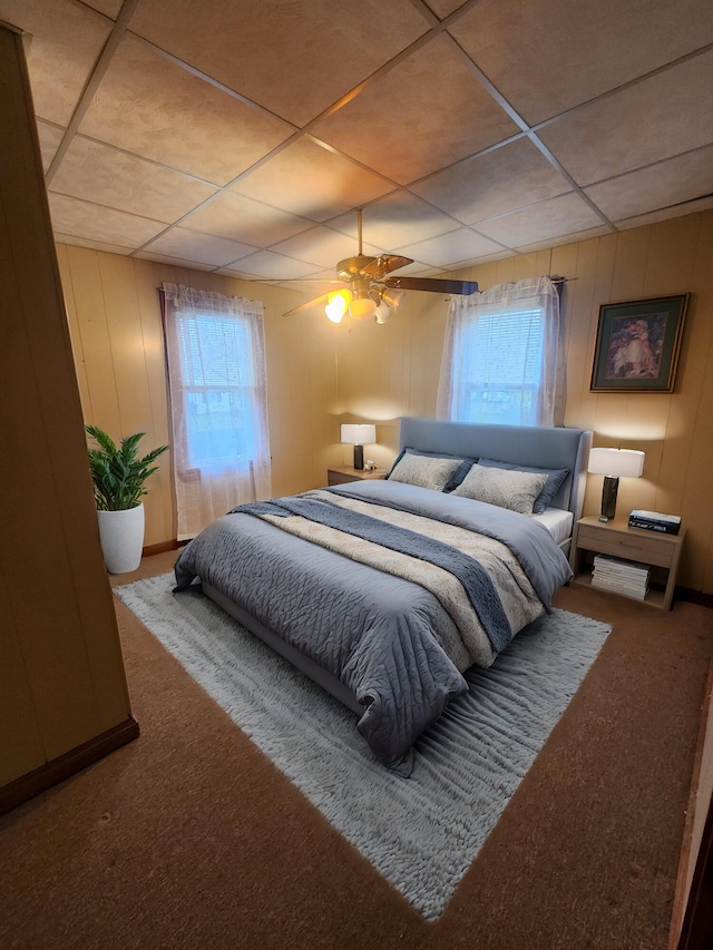 bedroom with carpet flooring, multiple windows, and ceiling fan