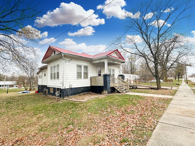 view of property exterior featuring a lawn