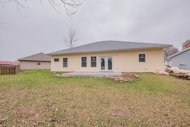 back of property featuring a patio area and a yard