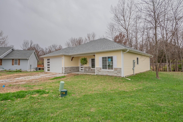 ranch-style house featuring central air condition unit, a front lawn, and a garage