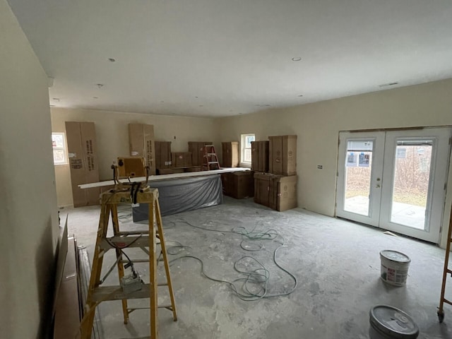 unfurnished living room featuring french doors