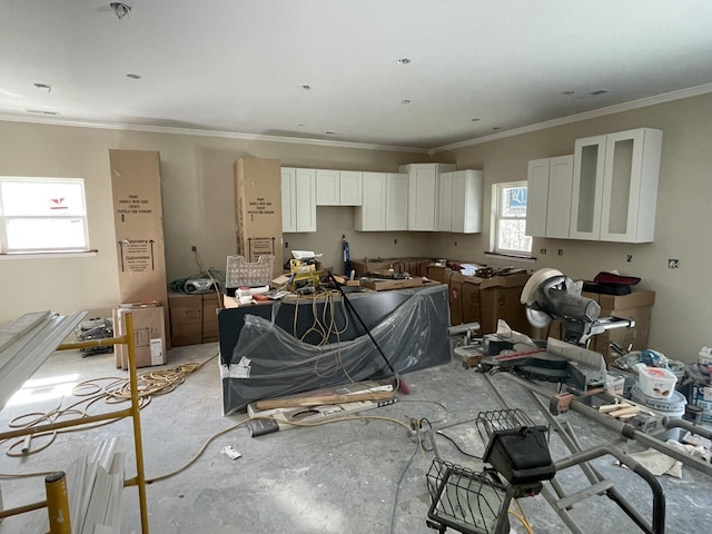 kitchen with white cabinetry and ornamental molding