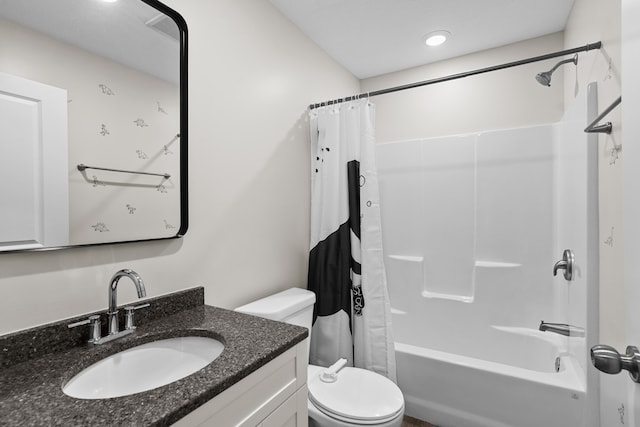 full bathroom featuring toilet, vanity, and shower / tub combo with curtain