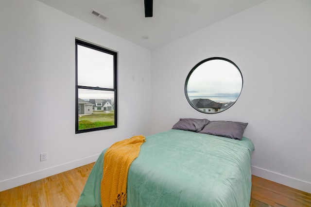 bedroom featuring ceiling fan and wood-type flooring