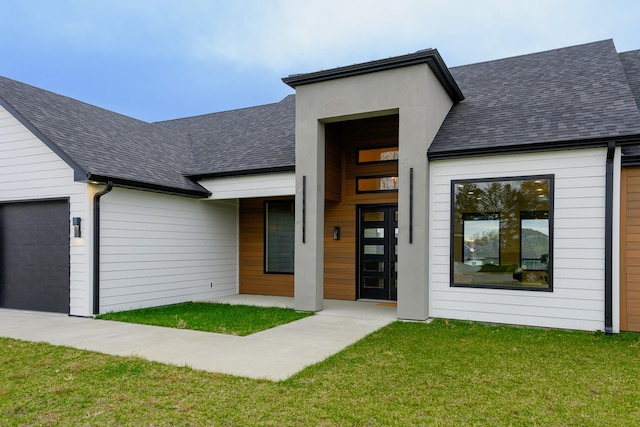 exterior space featuring a yard and a garage