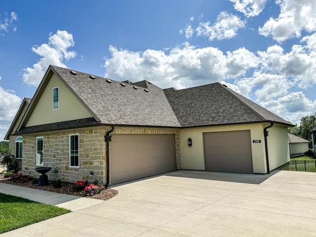 view of front of property with a garage