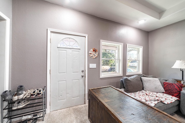 entryway with light carpet