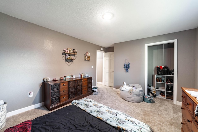 carpeted bedroom featuring a textured ceiling