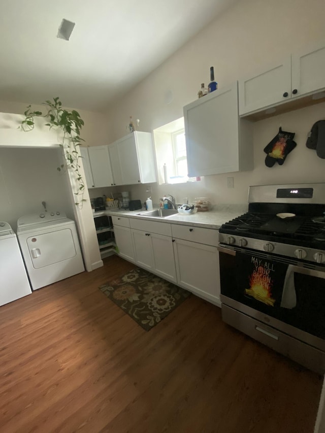 kitchen featuring white cabinets, washer and dryer, dark hardwood / wood-style floors, and stainless steel gas range