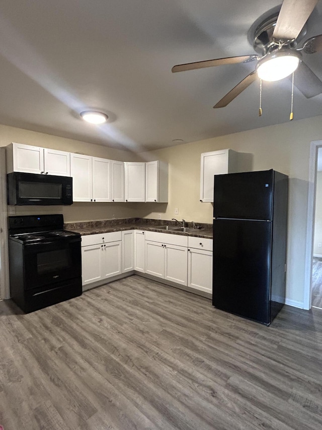 kitchen with ceiling fan, hardwood / wood-style floors, white cabinets, and black appliances