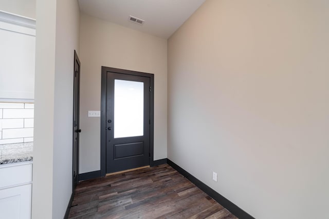 doorway with dark hardwood / wood-style floors