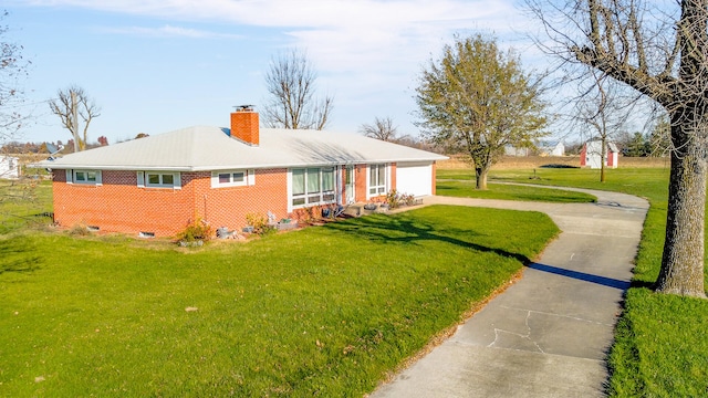 view of side of property featuring a yard