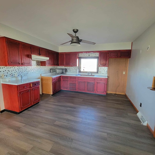 kitchen featuring ceiling fan, dark hardwood / wood-style flooring, sink, and tasteful backsplash