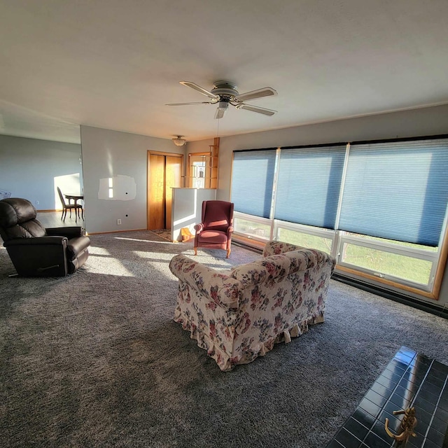 carpeted living room featuring ceiling fan