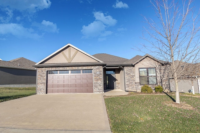 view of front of property featuring a garage and a front yard