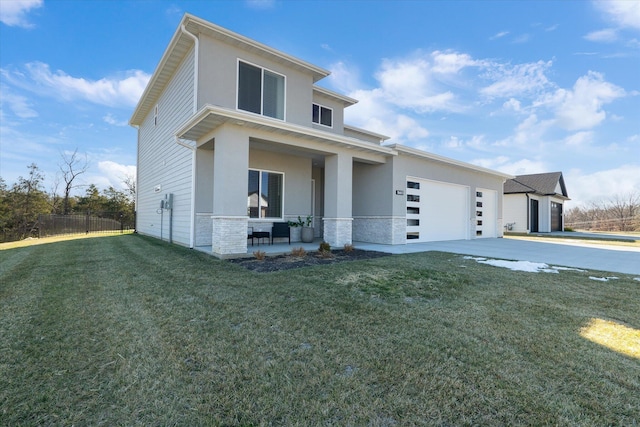 contemporary home with a front lawn, a porch, and a garage