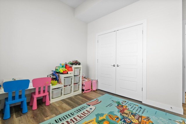 rec room with dark wood-type flooring