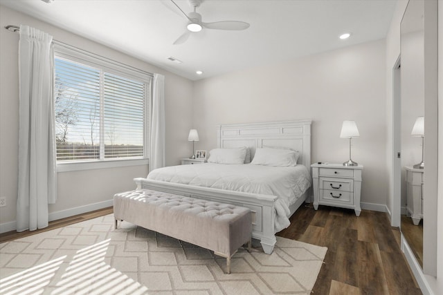 bedroom with hardwood / wood-style floors and ceiling fan