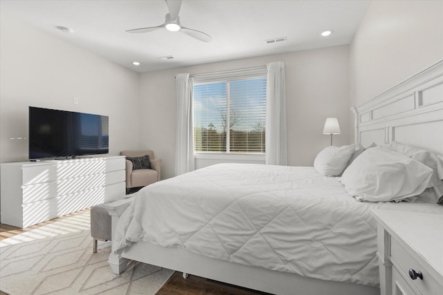 bedroom with hardwood / wood-style floors and ceiling fan