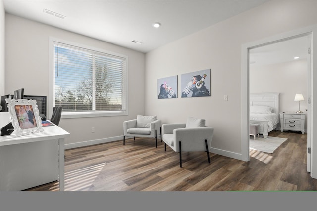 sitting room featuring dark hardwood / wood-style flooring