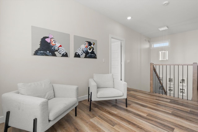 sitting room featuring hardwood / wood-style floors