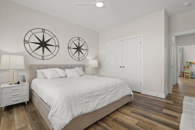 bedroom with ceiling fan, a closet, and dark hardwood / wood-style floors