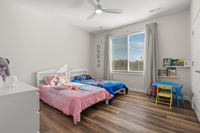 bedroom featuring ceiling fan and dark hardwood / wood-style floors