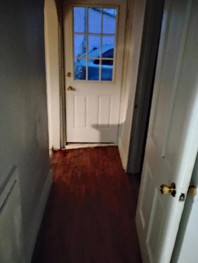 hallway with hardwood / wood-style floors