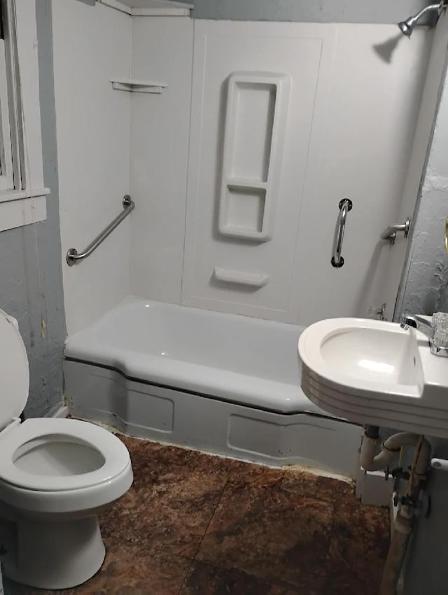 full bathroom featuring toilet, sink, and tub / shower combination