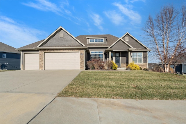 craftsman inspired home featuring a garage and a front lawn