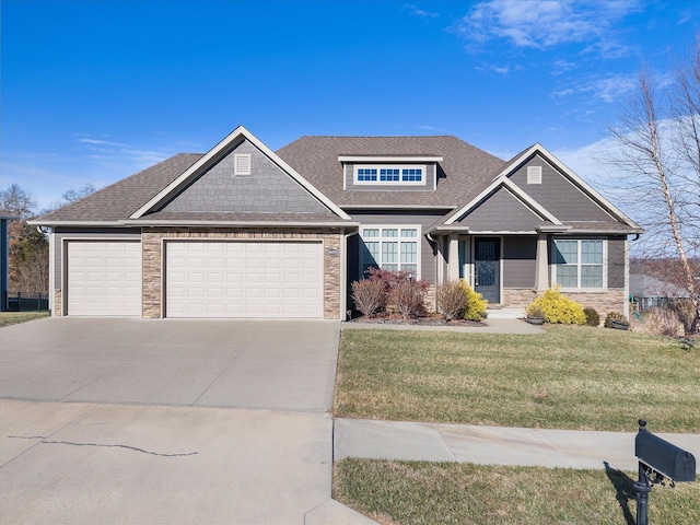 view of front of property with a garage and a front lawn