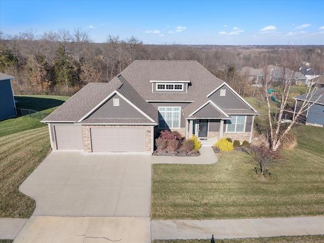 view of front of house with a garage and a front yard