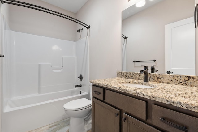 full bathroom featuring bathing tub / shower combination, hardwood / wood-style floors, vanity, and toilet