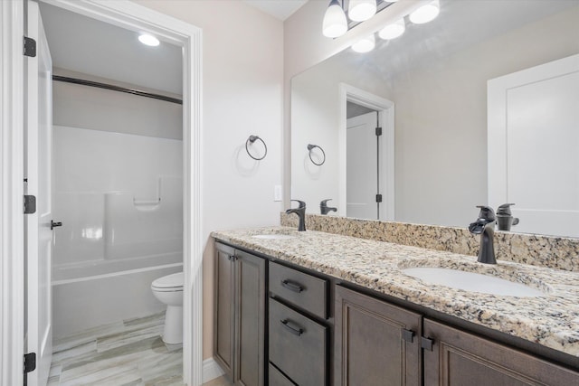 full bathroom with shower / bathing tub combination, vanity, and toilet