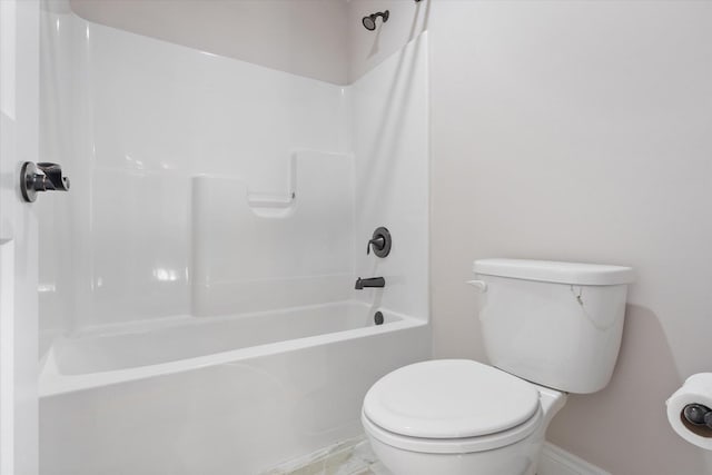 bathroom featuring bathing tub / shower combination and toilet