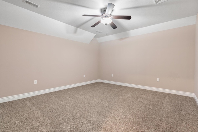 spare room featuring ceiling fan, carpet, and lofted ceiling