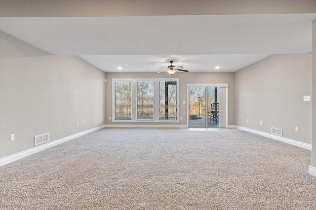 unfurnished living room featuring carpet flooring and ceiling fan