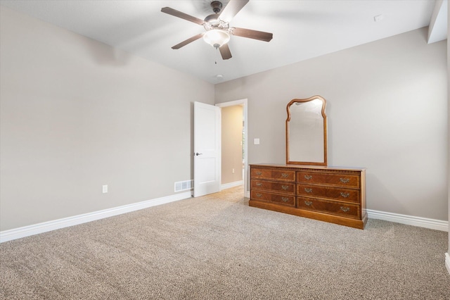 unfurnished bedroom with carpet flooring and ceiling fan