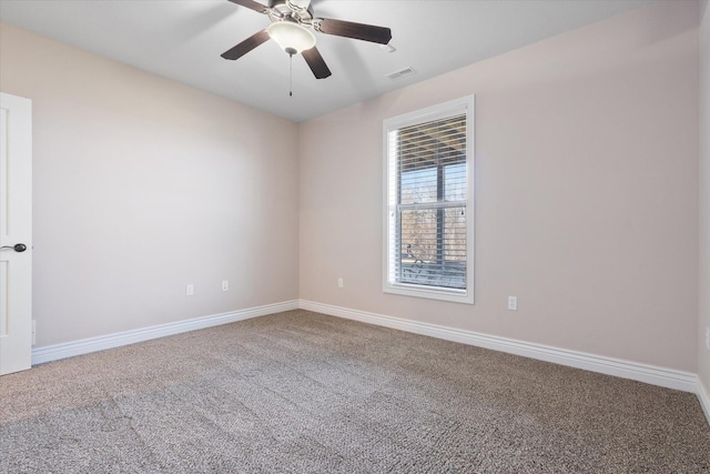 spare room with carpet flooring and ceiling fan