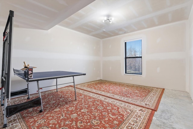 playroom featuring concrete flooring