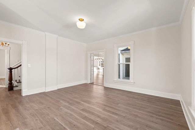 unfurnished room with wood-type flooring and crown molding