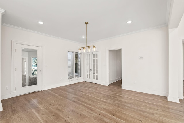 unfurnished dining area with light wood-type flooring and ornamental molding