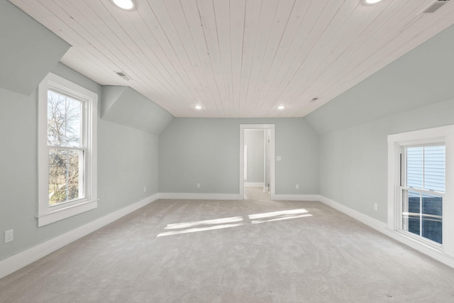 bonus room with wooden ceiling, plenty of natural light, and lofted ceiling